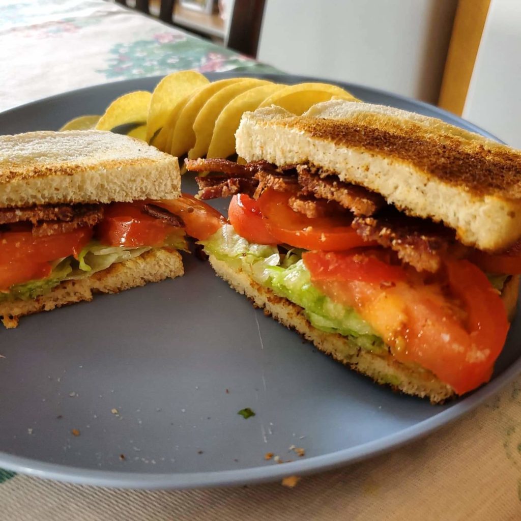 BLT on toasted sourdough bread with potato chips