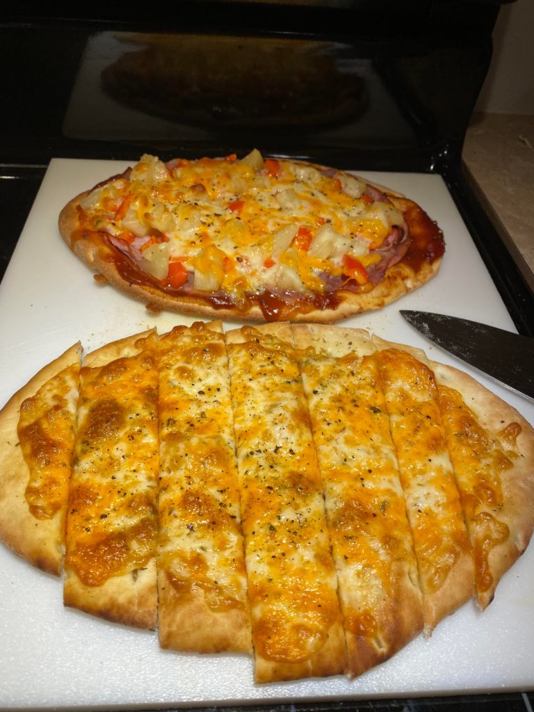 Pizza party. Cheese plus ham and pineapple.