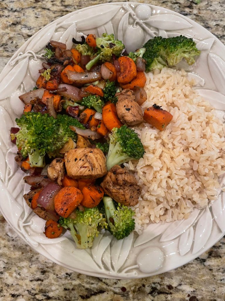 Chicken, carrots, and broccoli stir fry with brown rice