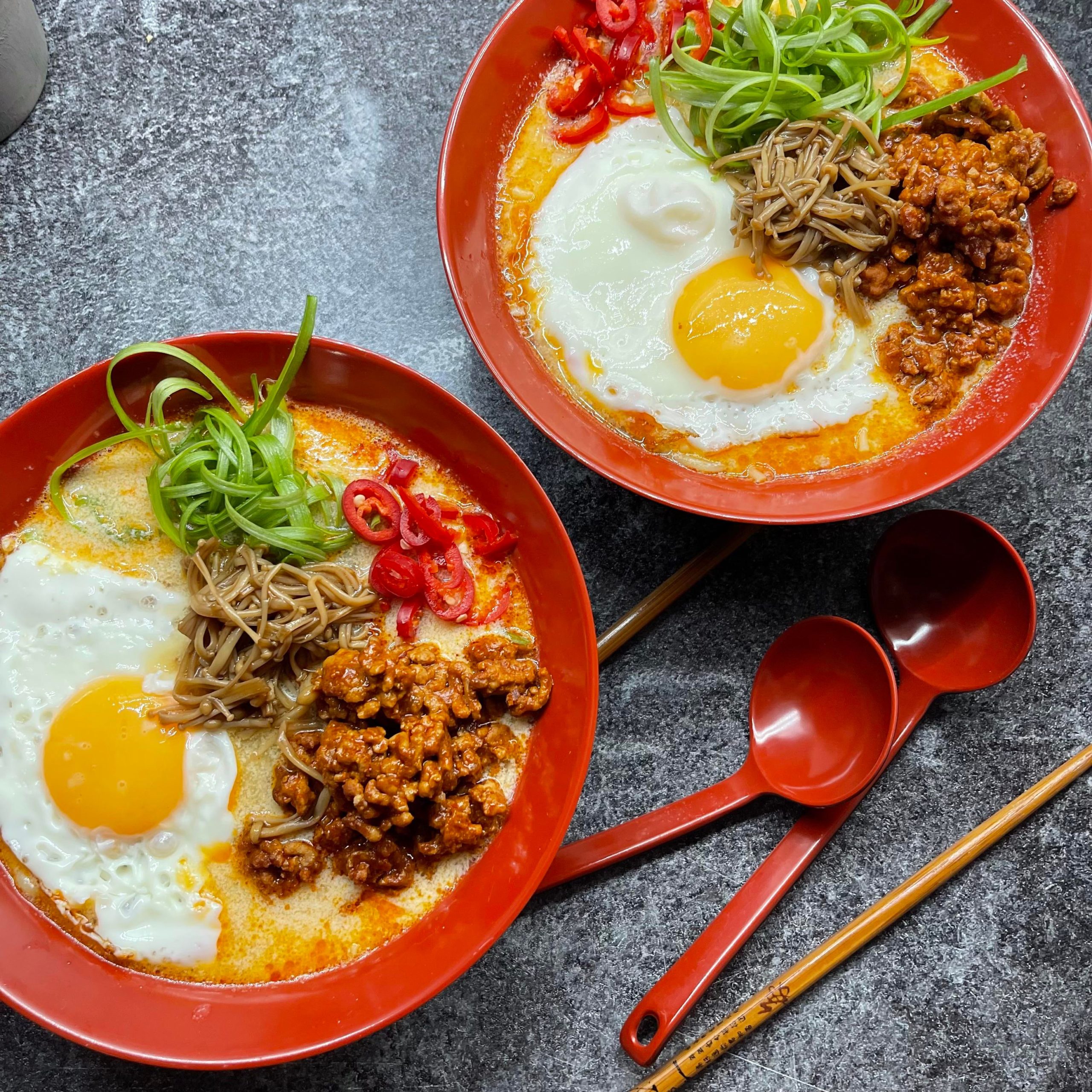 Tantanmen with fried egg and enoki mushrooms. Dining and Cooking