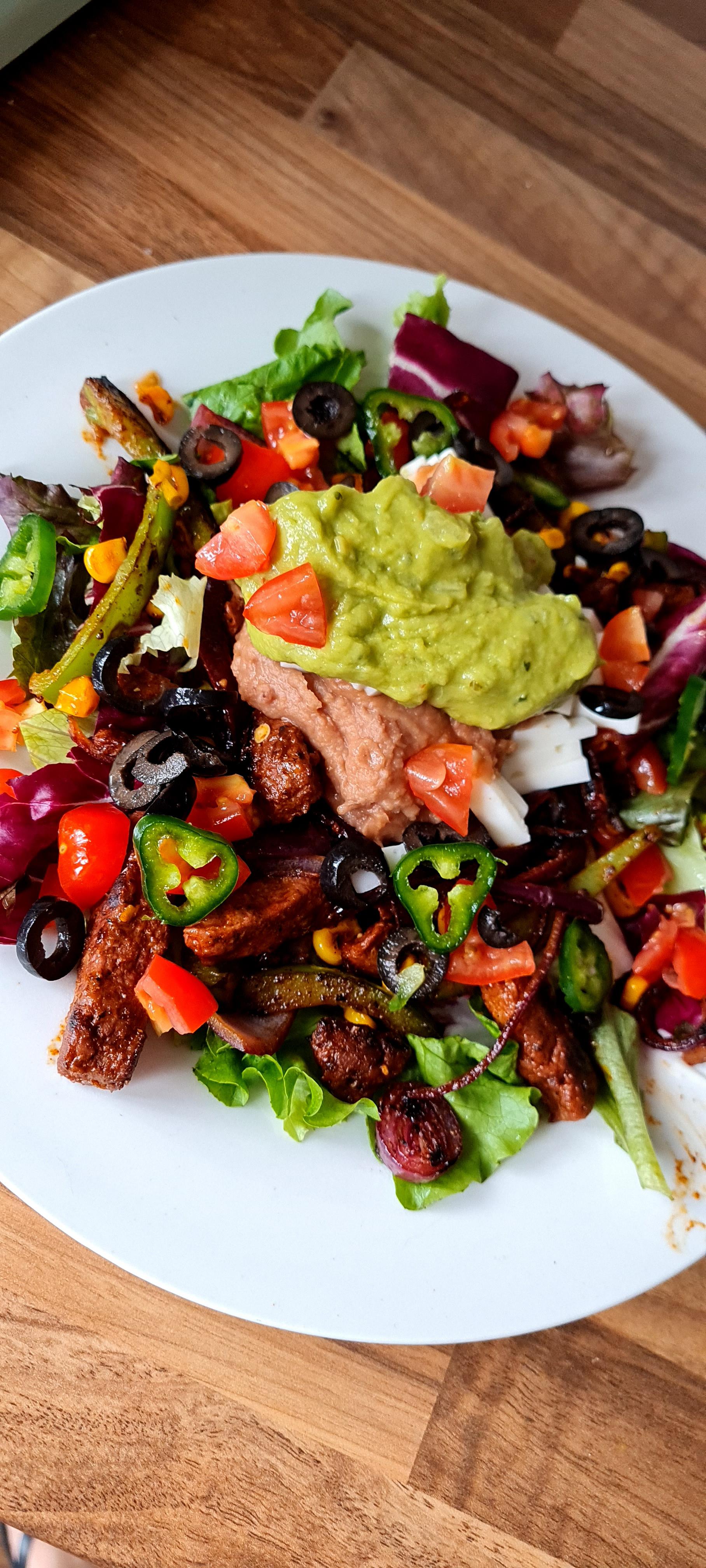 Taco salad. Combo of Aldi beefless strips and refried beans in there