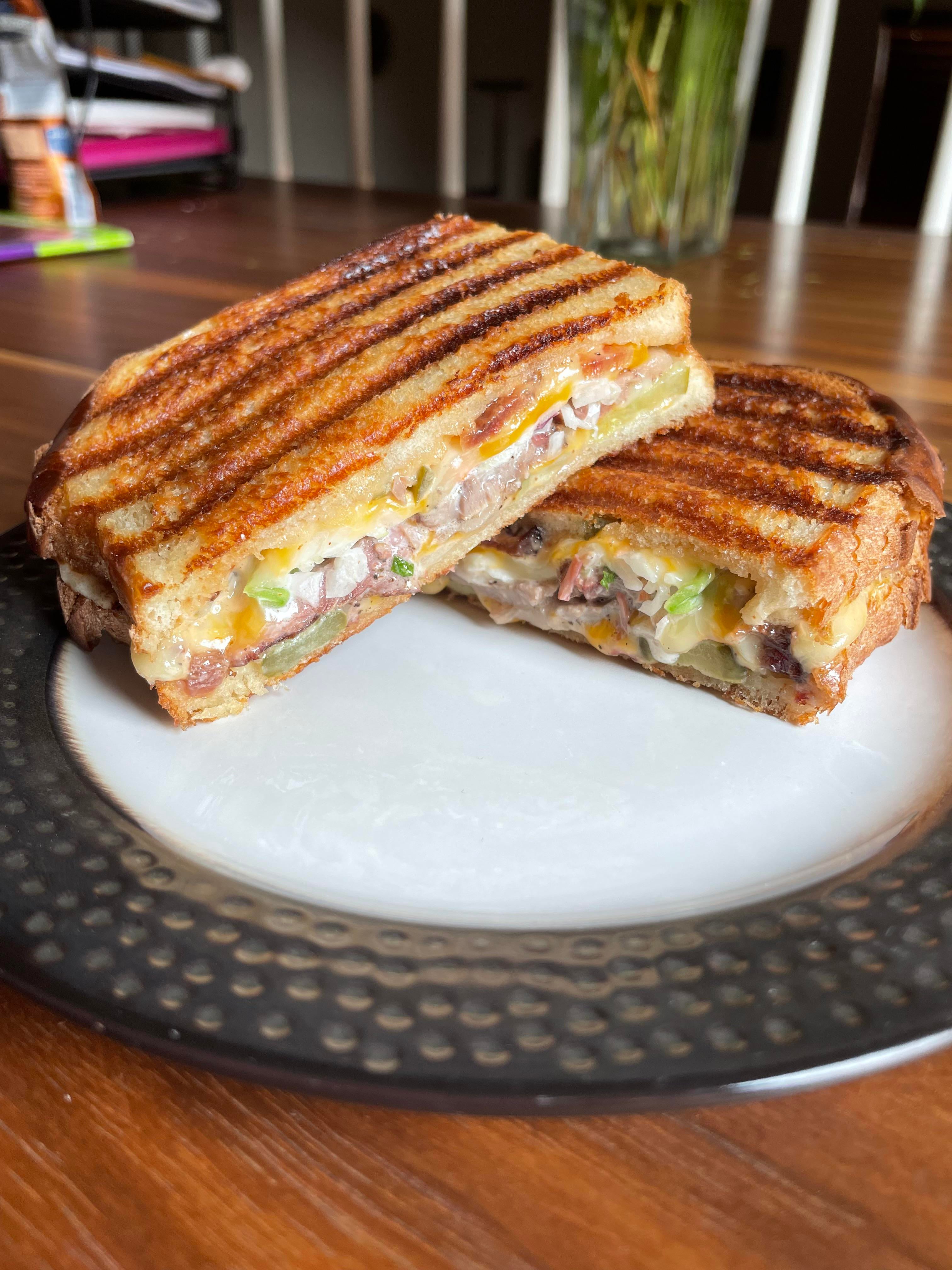 House smoked brisket, bacon, smokehouse cheddar, onion, pickles