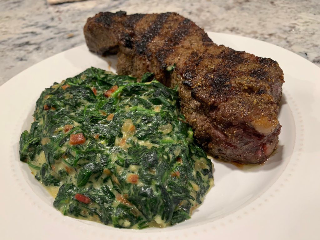 Rare New York Steak with Creamed Spinach.