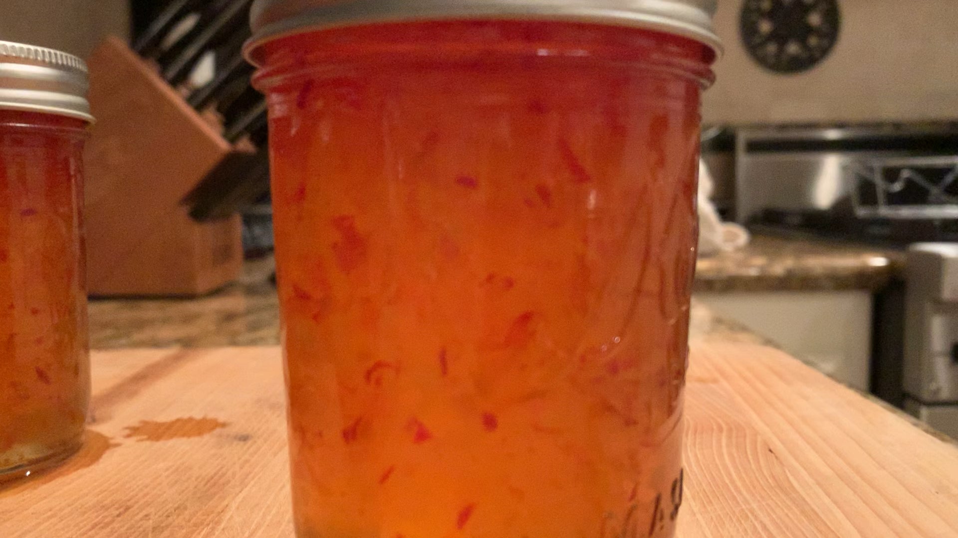 Can jam continue to boil in the jar after being removed from the water bath? (More in comments