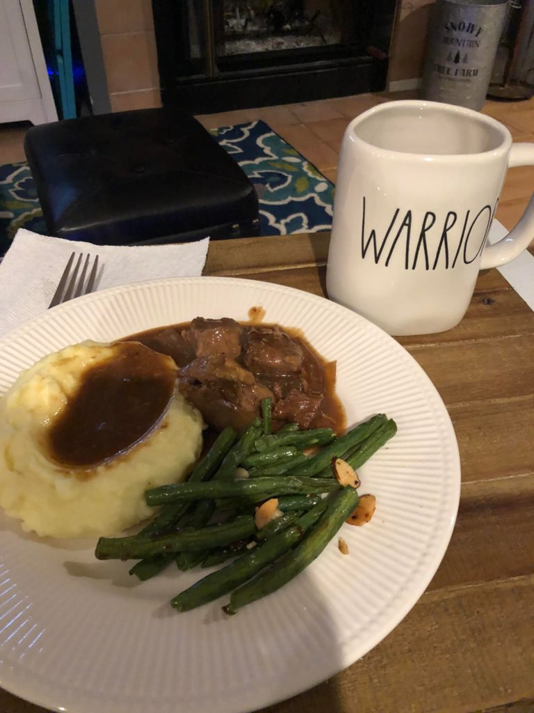 Beef tips and gravy, mashed potatoes, and green beans