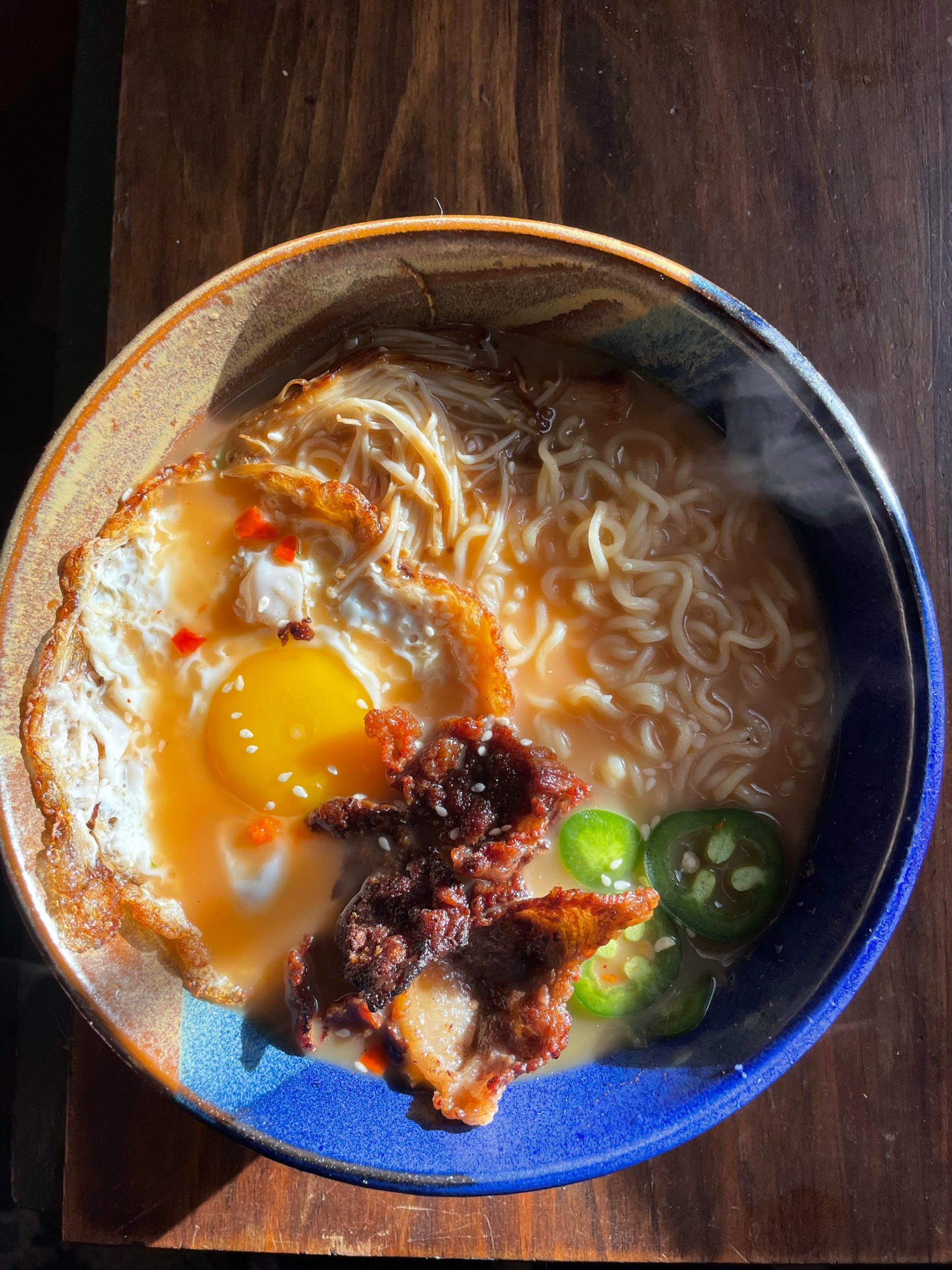 Gyukotsu with thin sliced brisket, jalapeños, seared enoki, and a runny