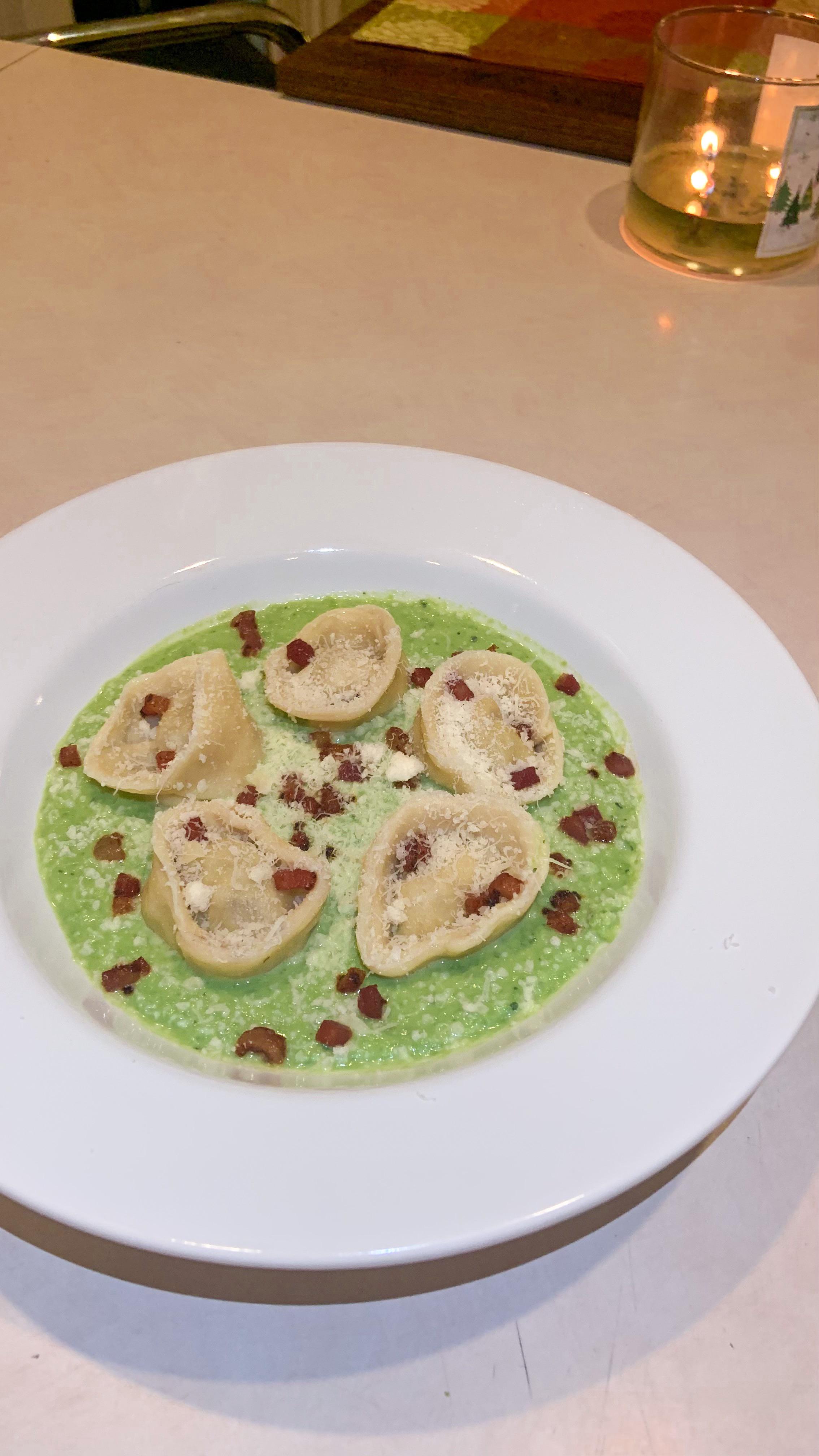 Mascarpone lamb tortellini, mint pea purée sauce, crispy pancetta