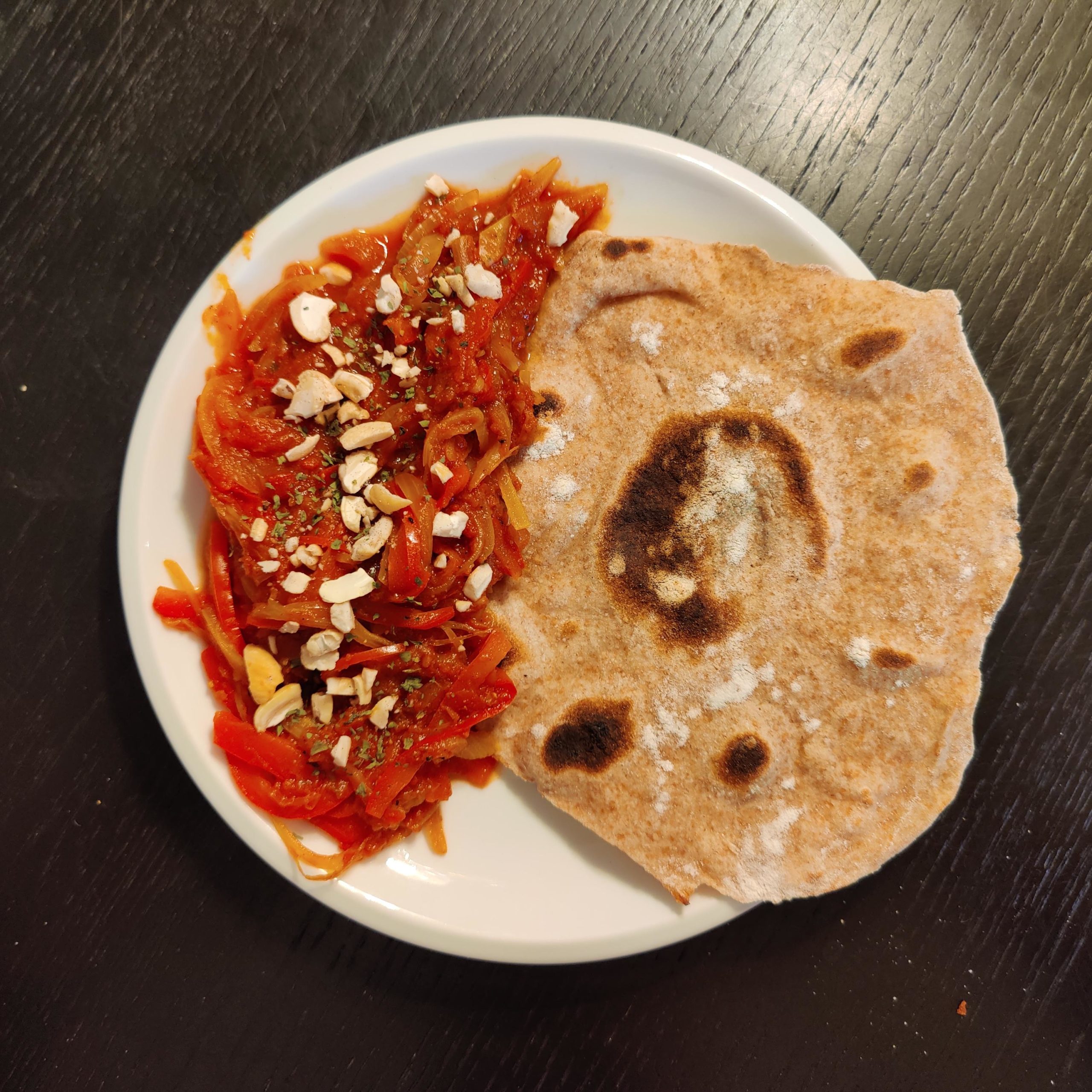 Vegetable Karahi with self made roti bread topped with toasted cashews