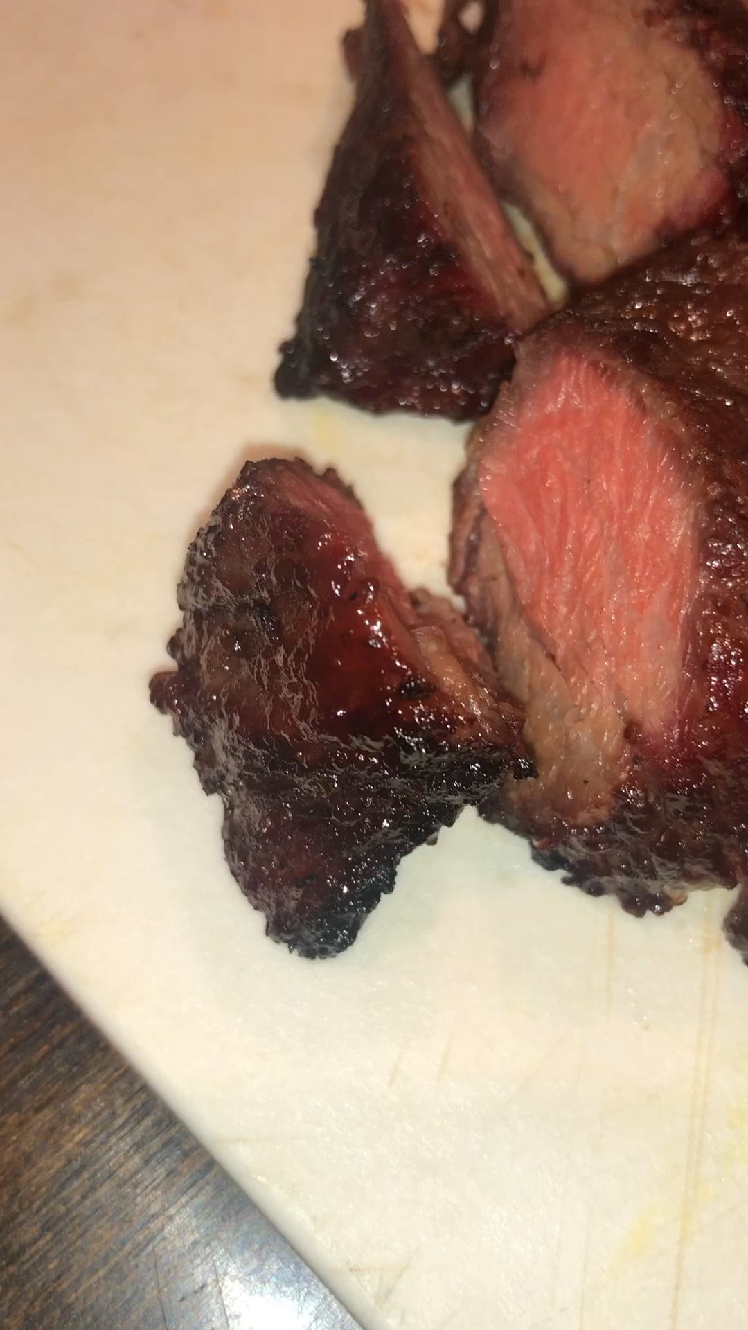 Reverse seared marinated boneless and boned short ribs on a vision Kamado smoker. Boneless short