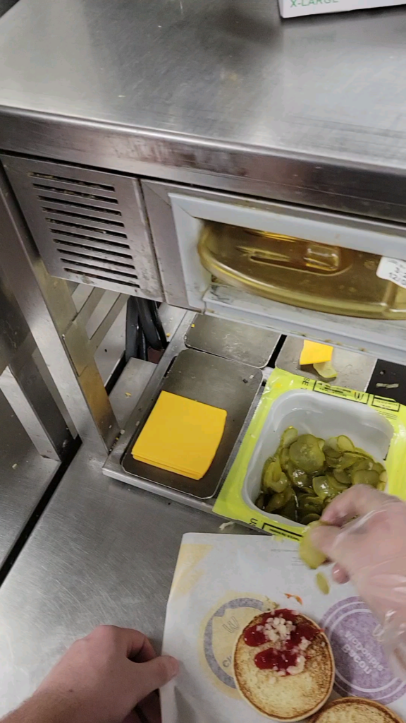 A Master McDonald's employee cooking an entire Big Mac burger in mere seconds! Be amazed!