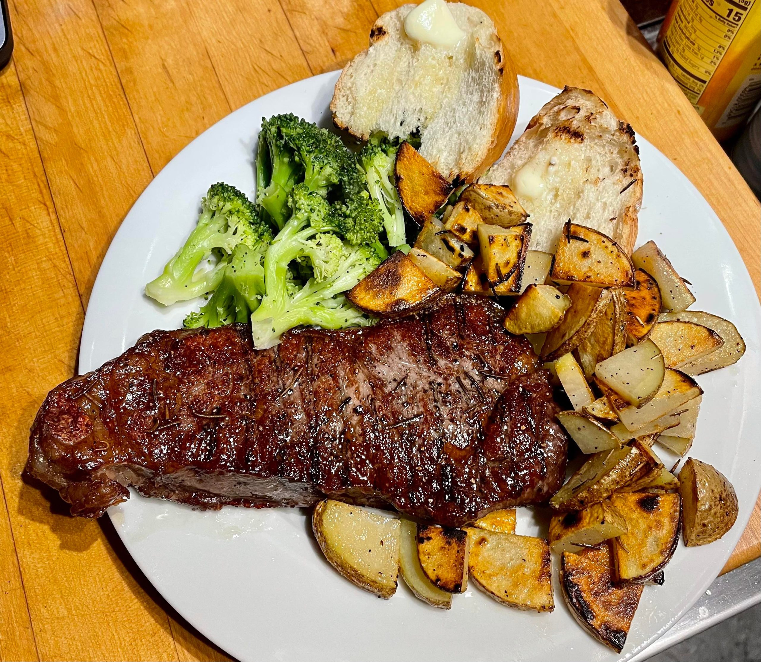 NY strip steak and potatoes in the cast iron (butter, olive oil