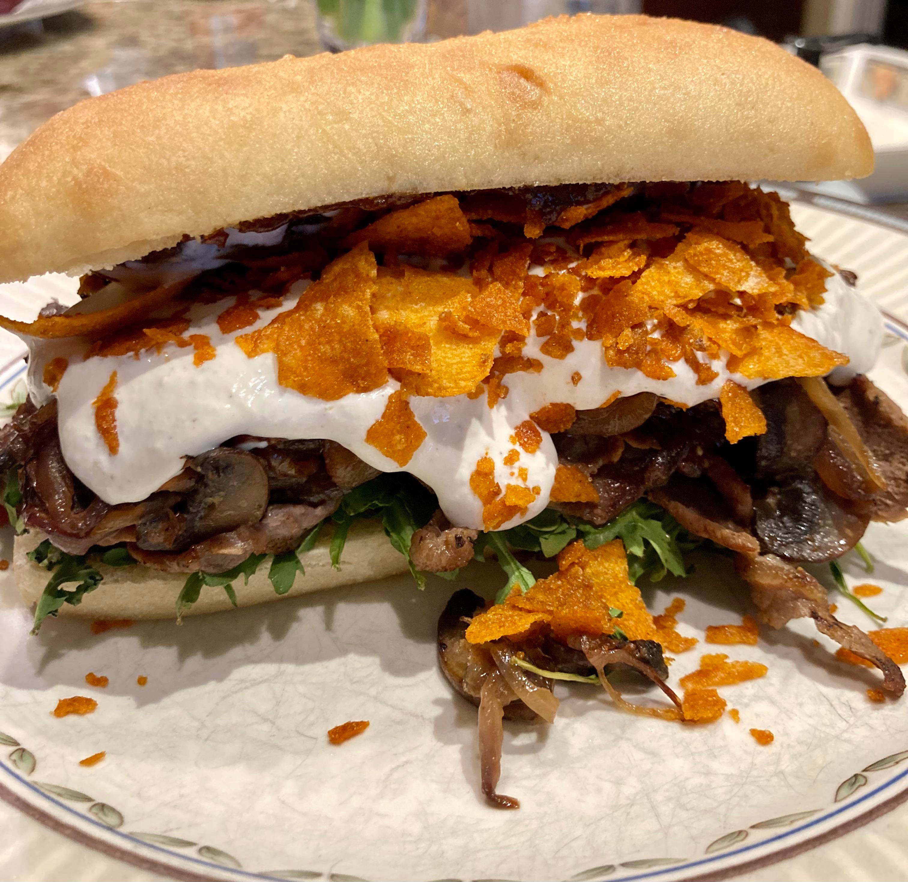 Steak sandwich with horseradish sauce and Grippos bbq chips Dining