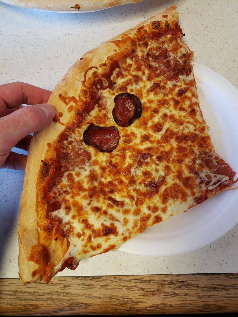 Street slice in Halifax, Nova Scotia. It's like a third of a damn pizza and delicious