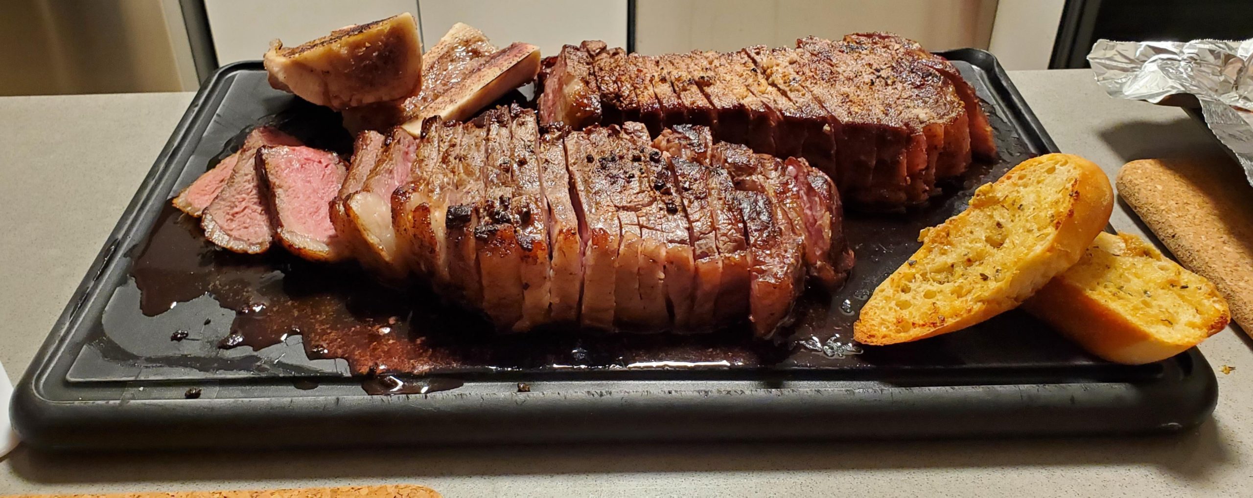 Reverse seared steak with garlic bread and torched bone marrow Dining