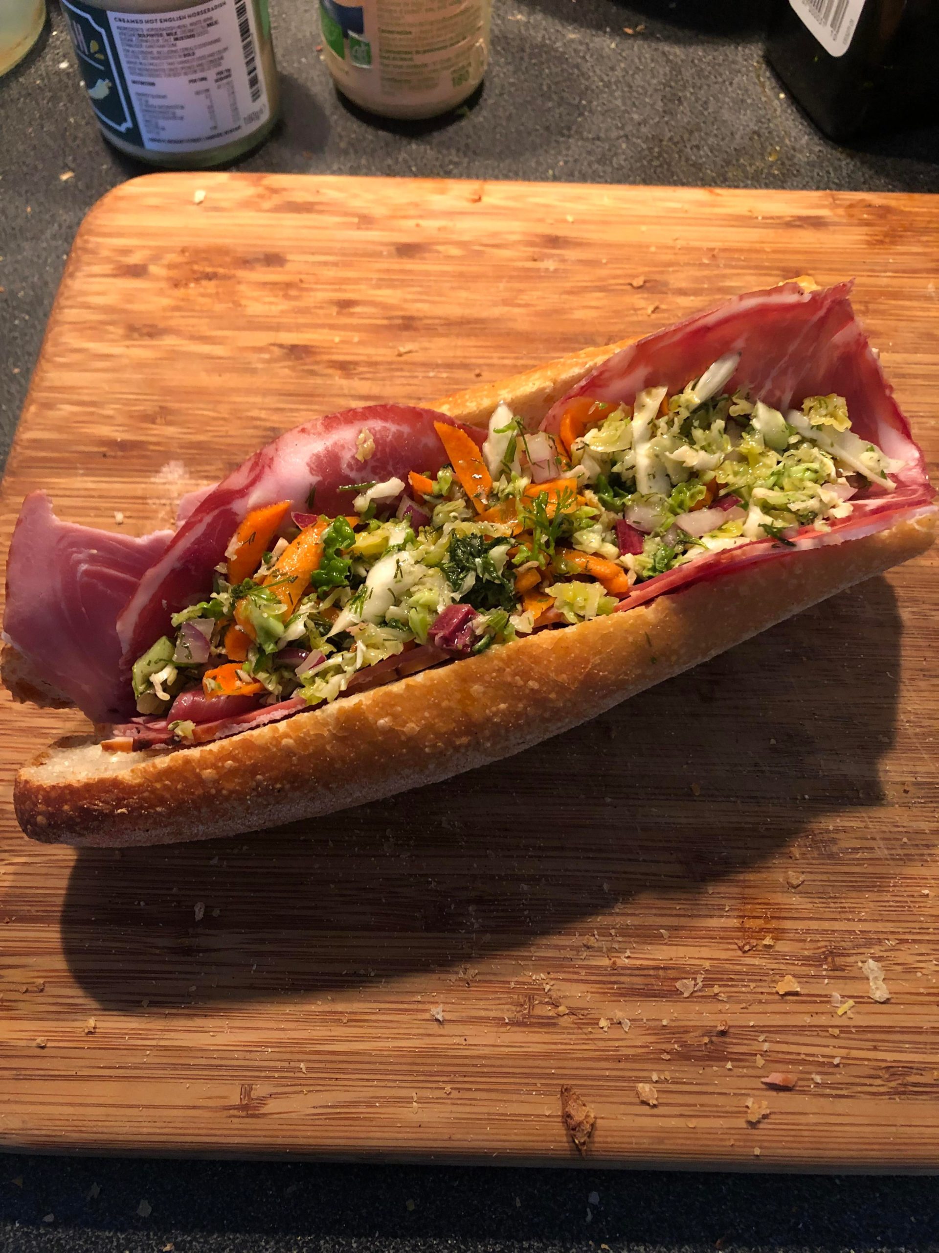 Smoked chicken, smoked ham, Copa and vinegar coleslaw with a horseradish cream spread on