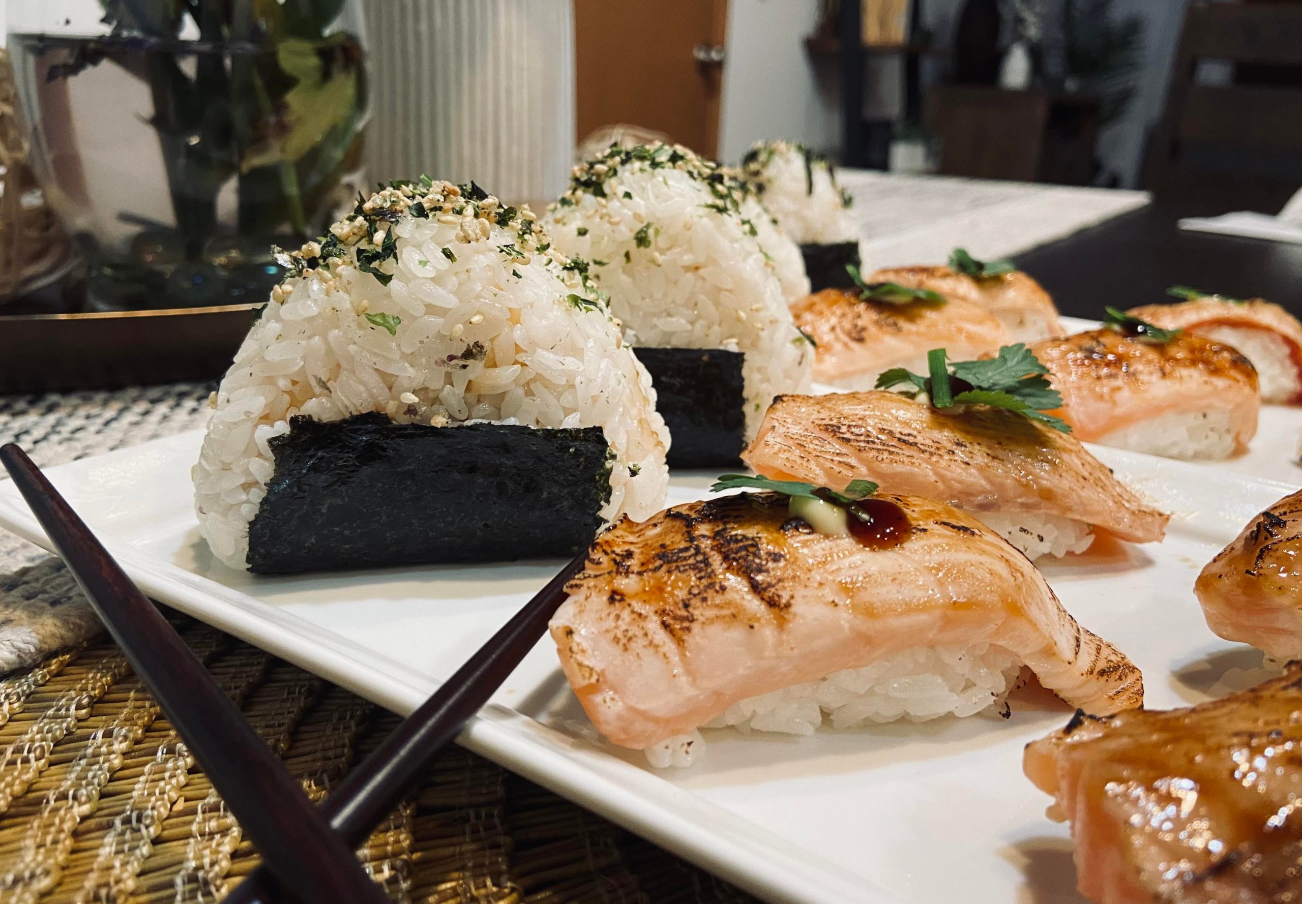Homemade Onigiri with spicy crab and shrimp, and Seared salmon nigiri. Dining and Cooking