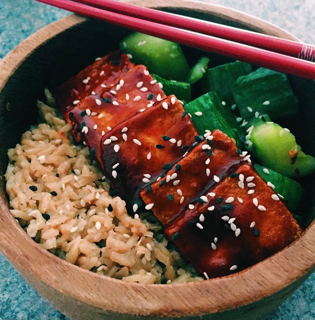 Gochujang glazed crispy tofu with brown rice and smashed cucumber salad