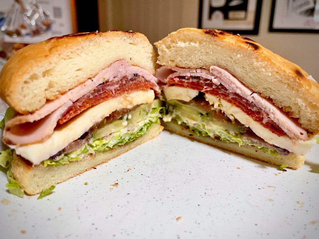 Gluten free Italian sub: Salami, pepperoni, ham, lettuce, heirloom tomato, cucumber fresh mozz, Italian dressing and mayo