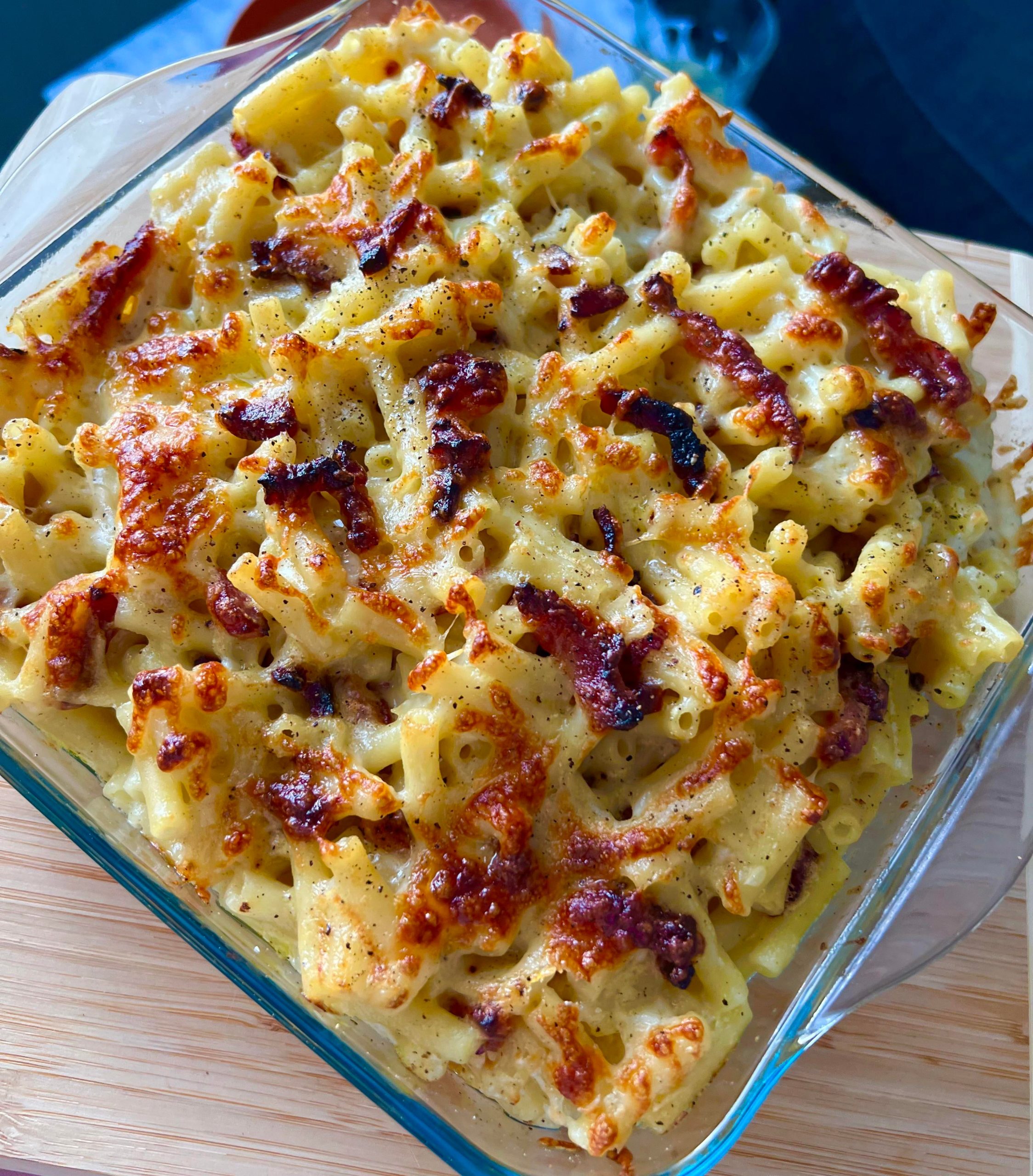 Macaroni cheese baked with smoked bacon, cheddar, mozzarella and cream cheese, topped with extra