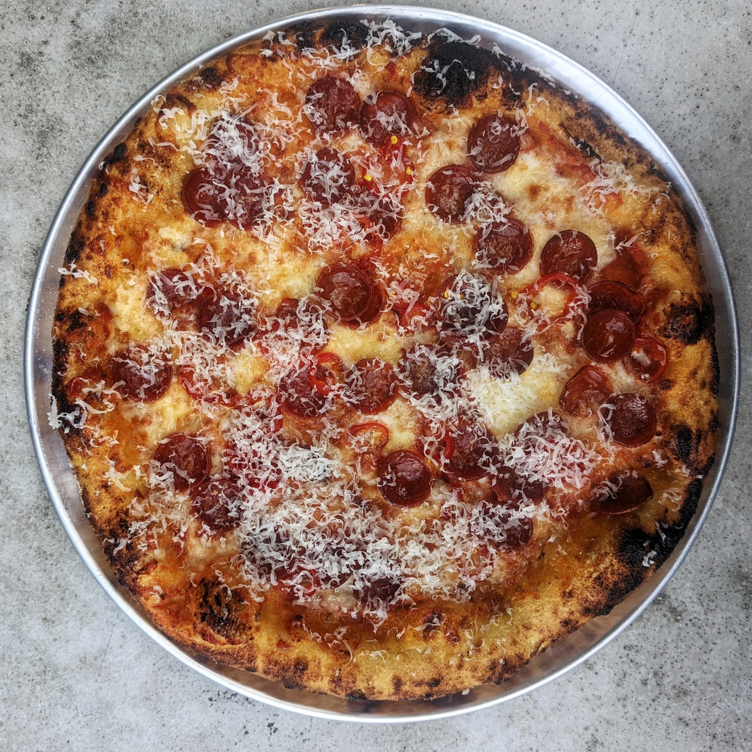 Peps and candied jalapenos (medicated olive oil on crust to finish