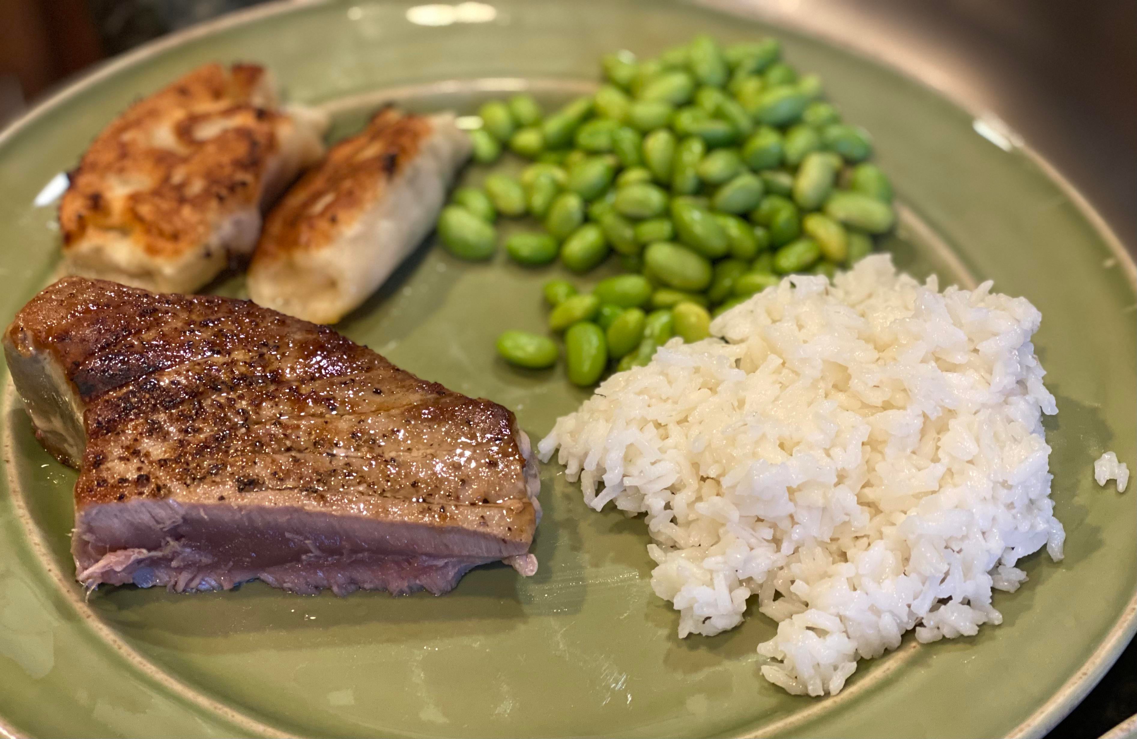 Seared tuna steak, crispy gyoza, edamame with white rice Dining and