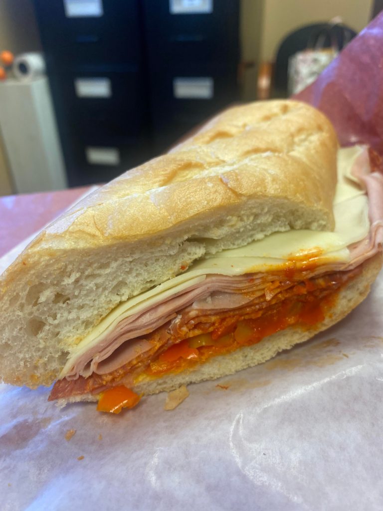 Hot Italian Sandwich from my local Italian bakery - provolone cheese, mortadella, salami, capocollo with vegetable spread and banana peppers