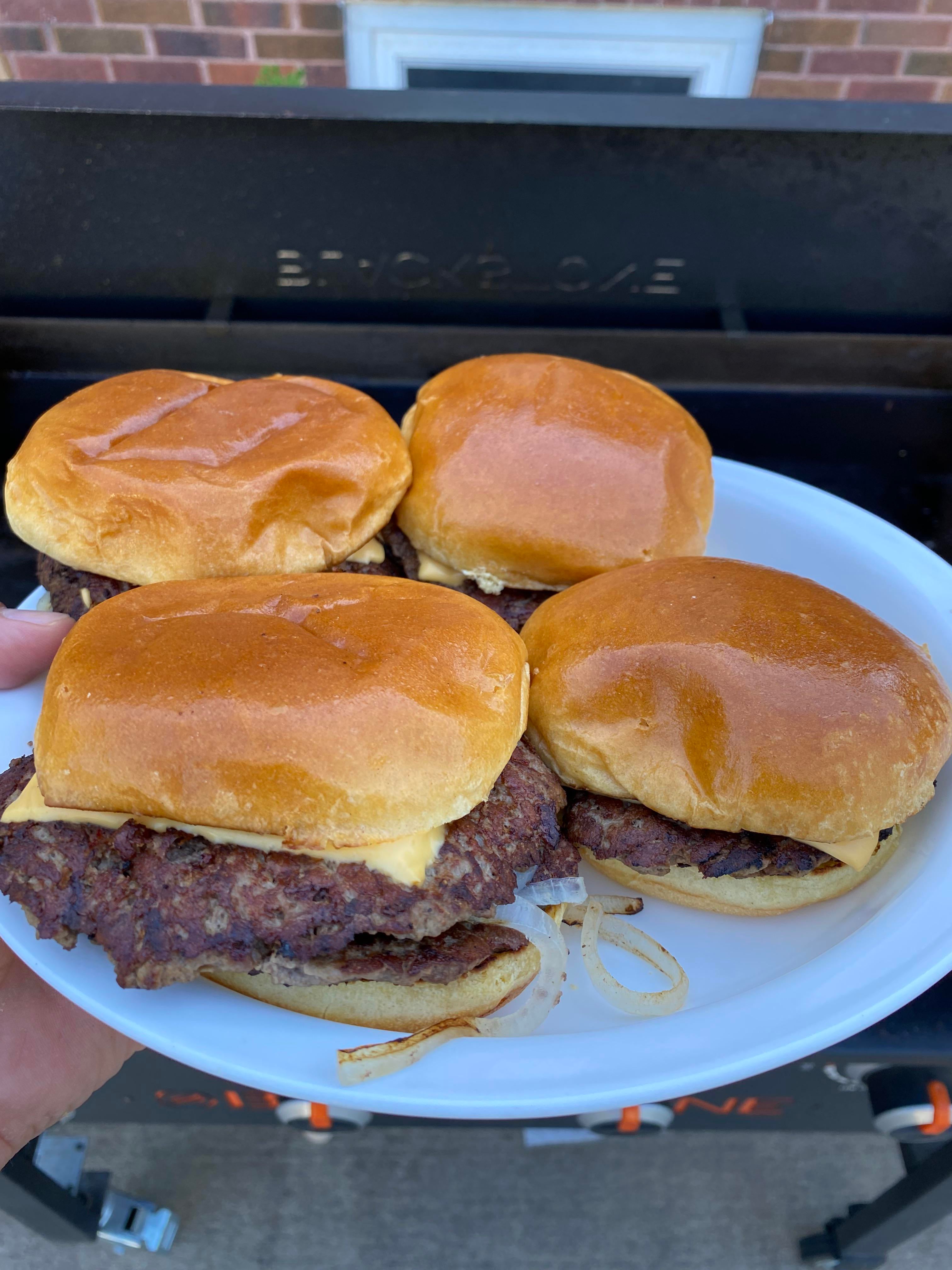 Smash burgers with cheese and onions Dining and Cooking
