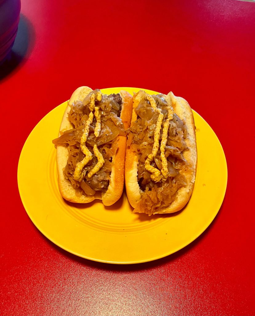 Beer brats with sauerkraut and onions