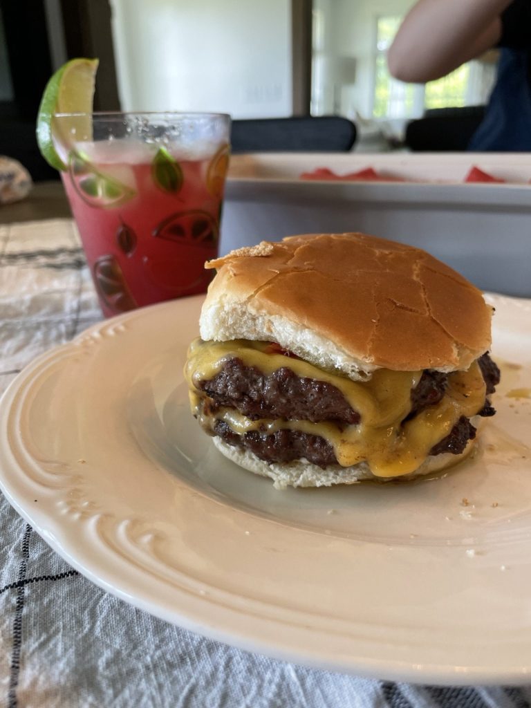 Some grilled smashed patties and a watermelon marg to wash it down