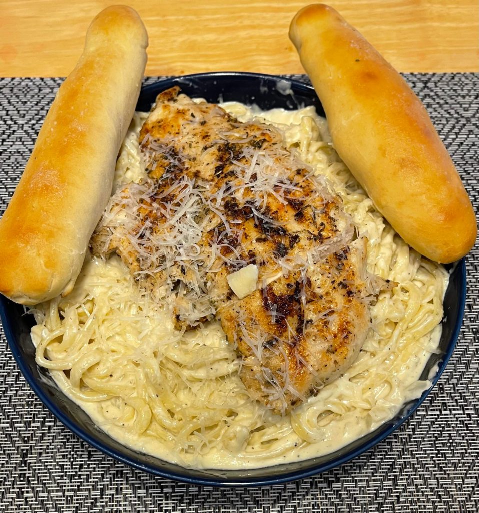 Homemade Chicken Alfredo and Bread Sticks