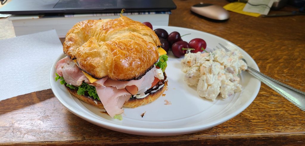 Ham sandwich on a toasted croissant.