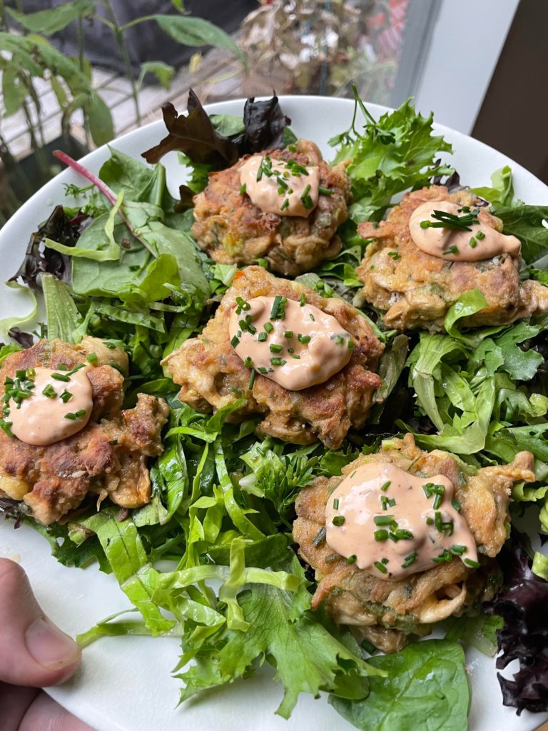 Lions mane “crab” cakes with remoulade sauce & chives on top