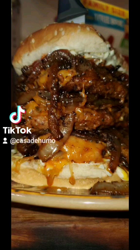 the triple triple OG Bacon and cheddar burger with sauteed onions and