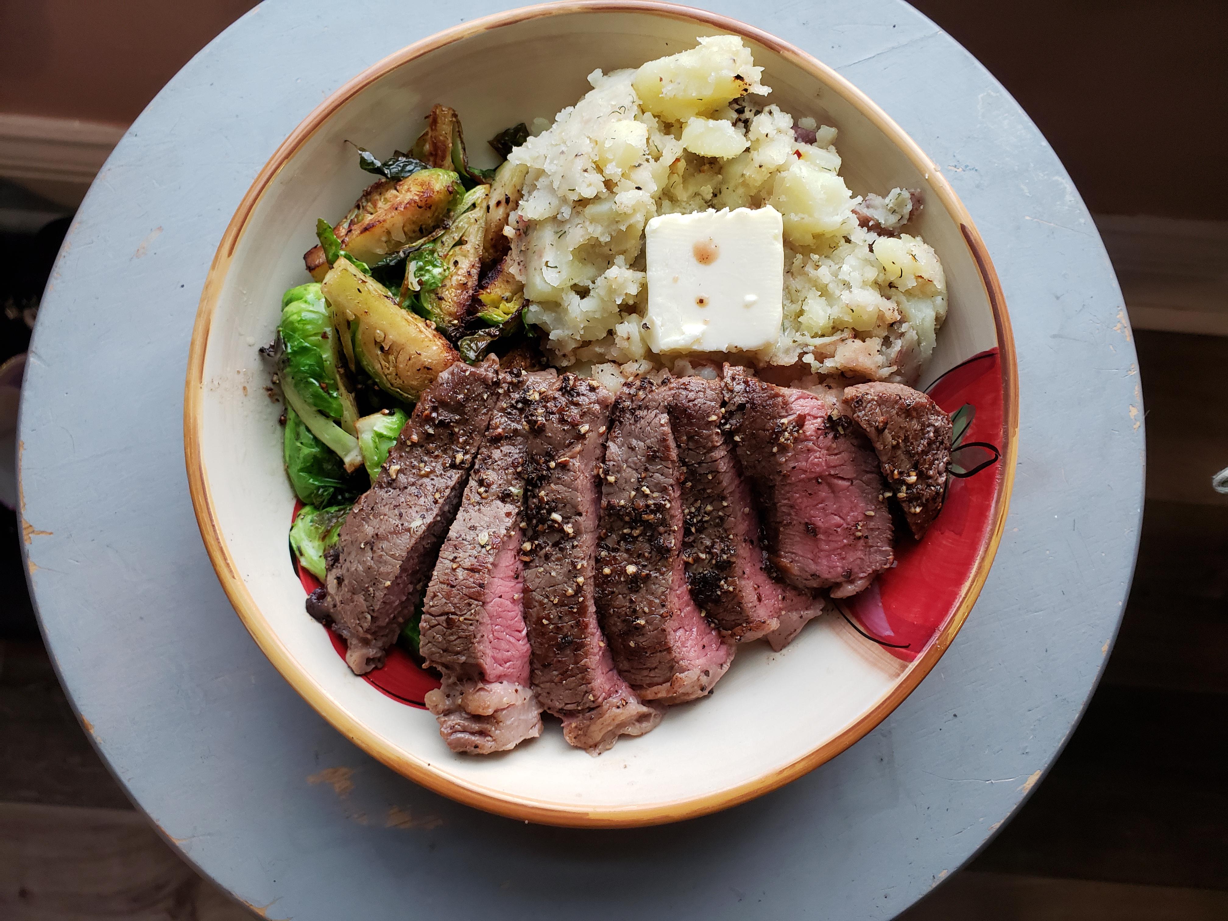 Steak with brussel sprouts and smashed potato. Dining and Cooking