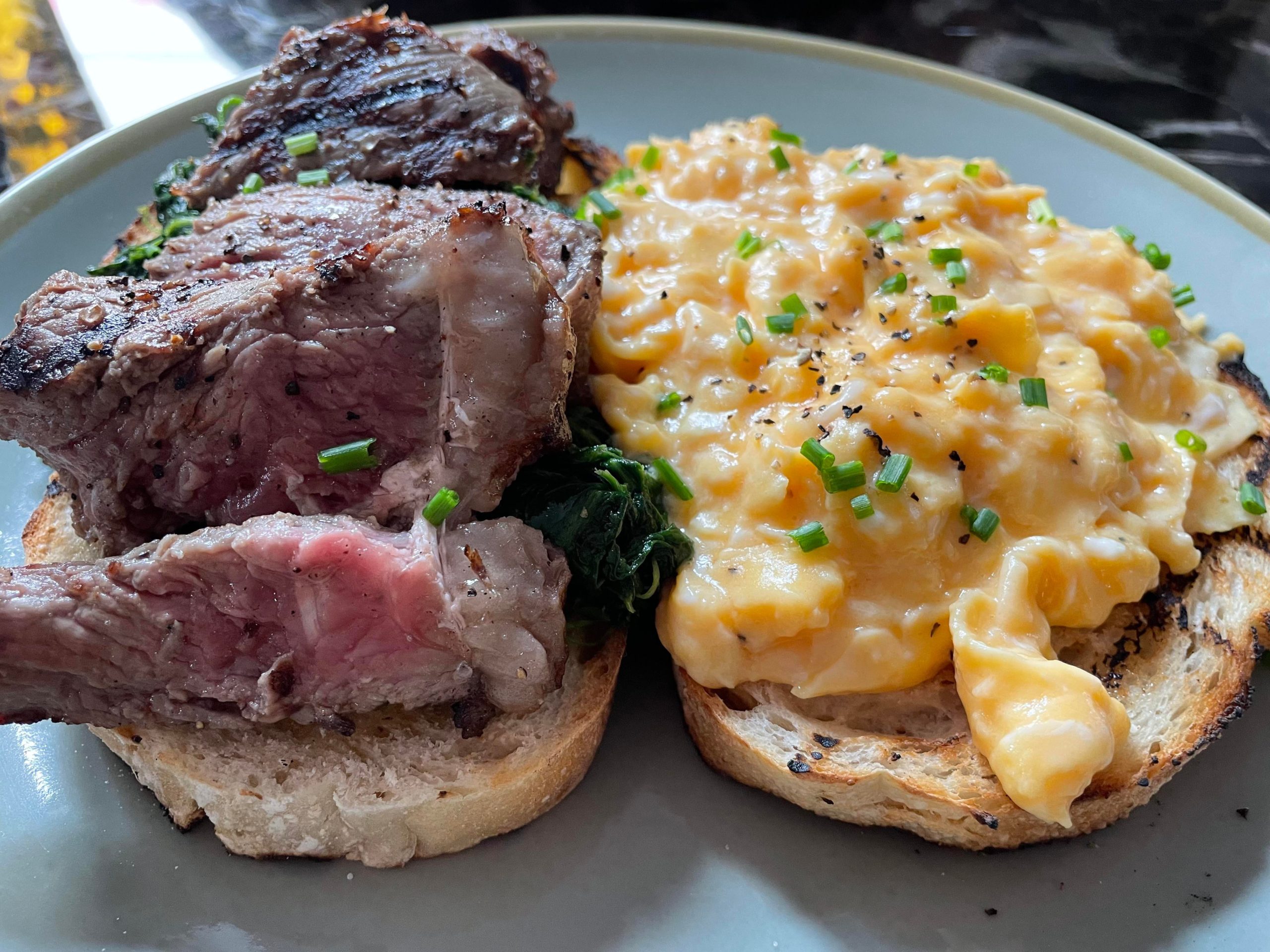 Medium rare sirloin and scrambled eggs brunch at the new local