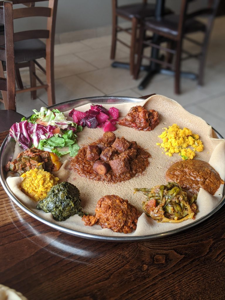 Injera with a variety of Ethiopian dishes