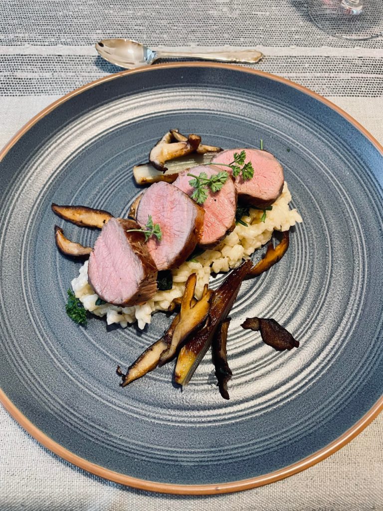 Sous vide loin of lamb with Parmesan risotto, roasted shallots and mushrooms.