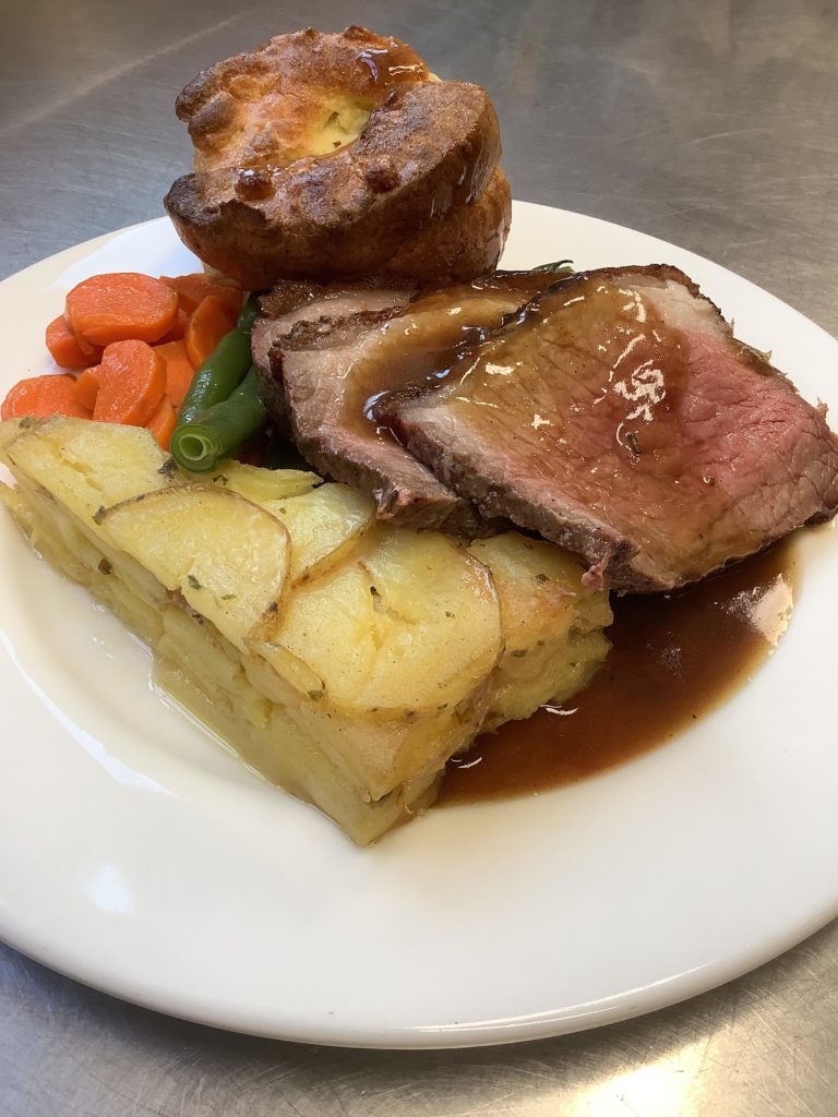 The yorkies popped! Roast beef dinner with Rosemary jus and Rosemary Pave potatoes.