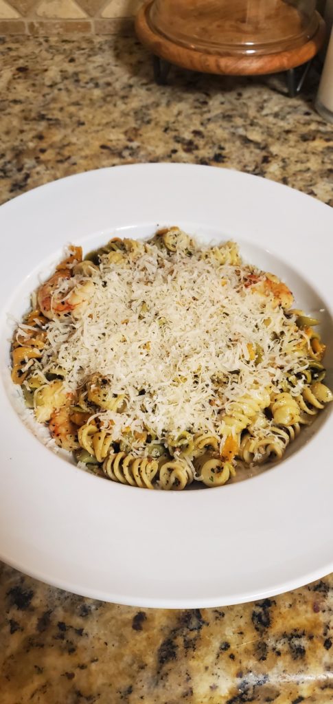 Rainbow rotini with a garlic butter sauce and grilled shrimp.