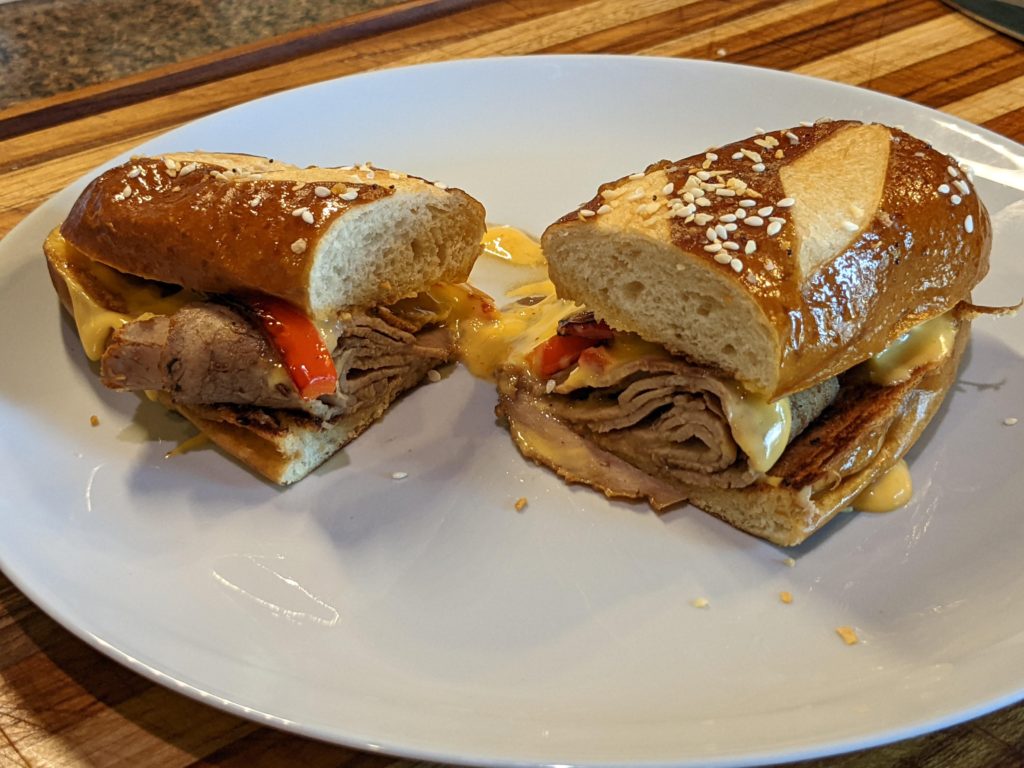 Homemade Roast Beef Sandwich on a Pretzel Bun