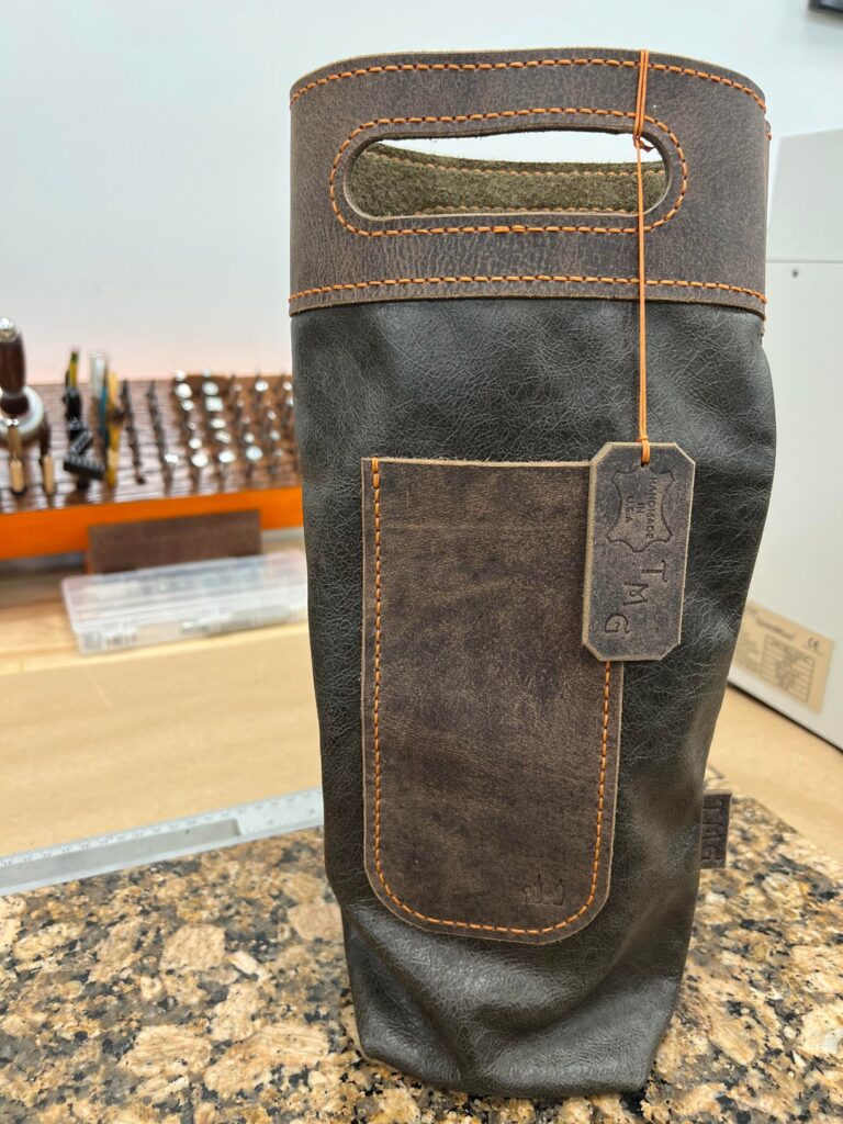 I made a “booze bag”. It’s for wine, but I only had champagne (it needs a bottle in it to stand up for pics). I put a pocket in front for an opener. Thought this community would think it’s cool. It’s completely hand stitched made with high quality leathers and is my own design.