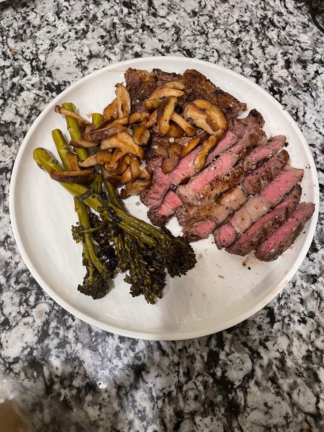 Reverse seared ribeye on the grill with grilled brocollini and sautéed ...