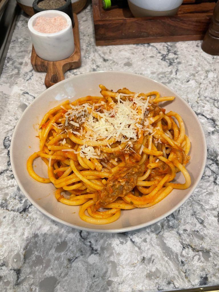 No idea what I made but it tastes good. Pomodoro sauce and left over shredded roast beef. Tasted kinda like bolognese