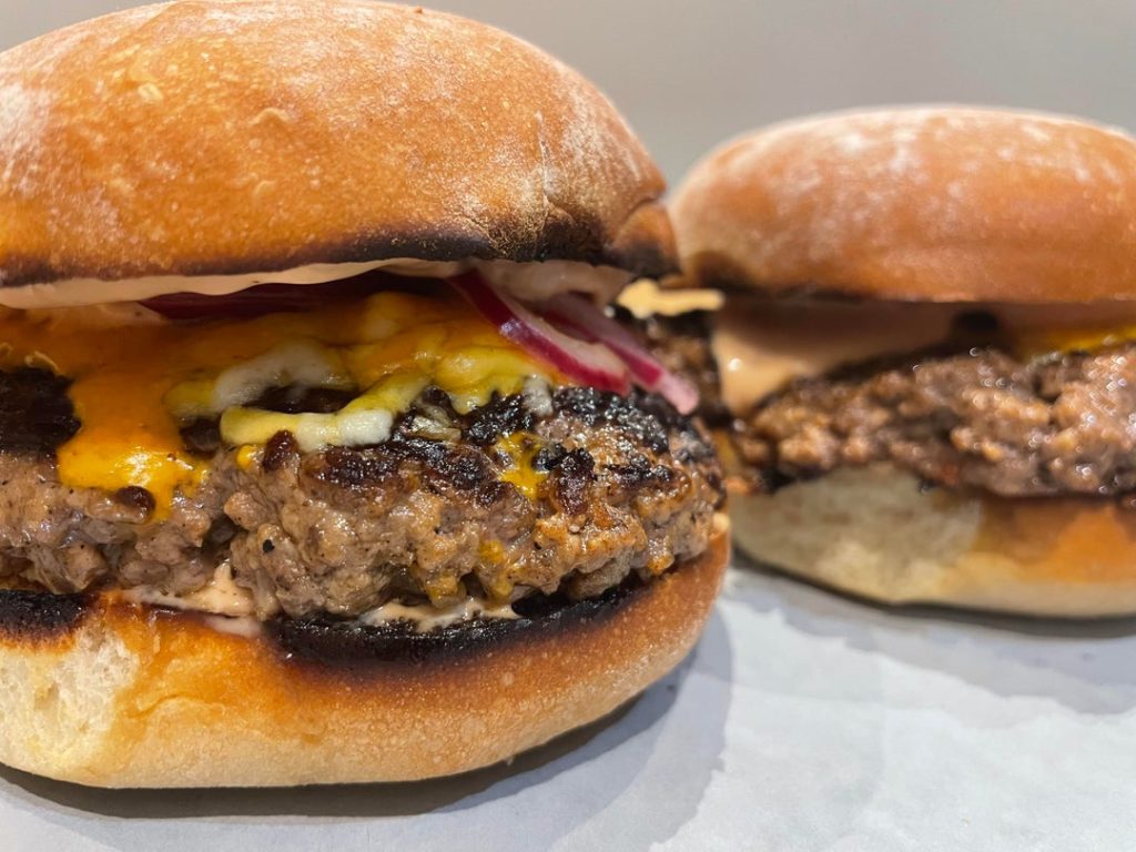 Cheeseburgers. W/ quick pickled red onions, cheddar and a homemade burger sauce on floury Irish baps.
