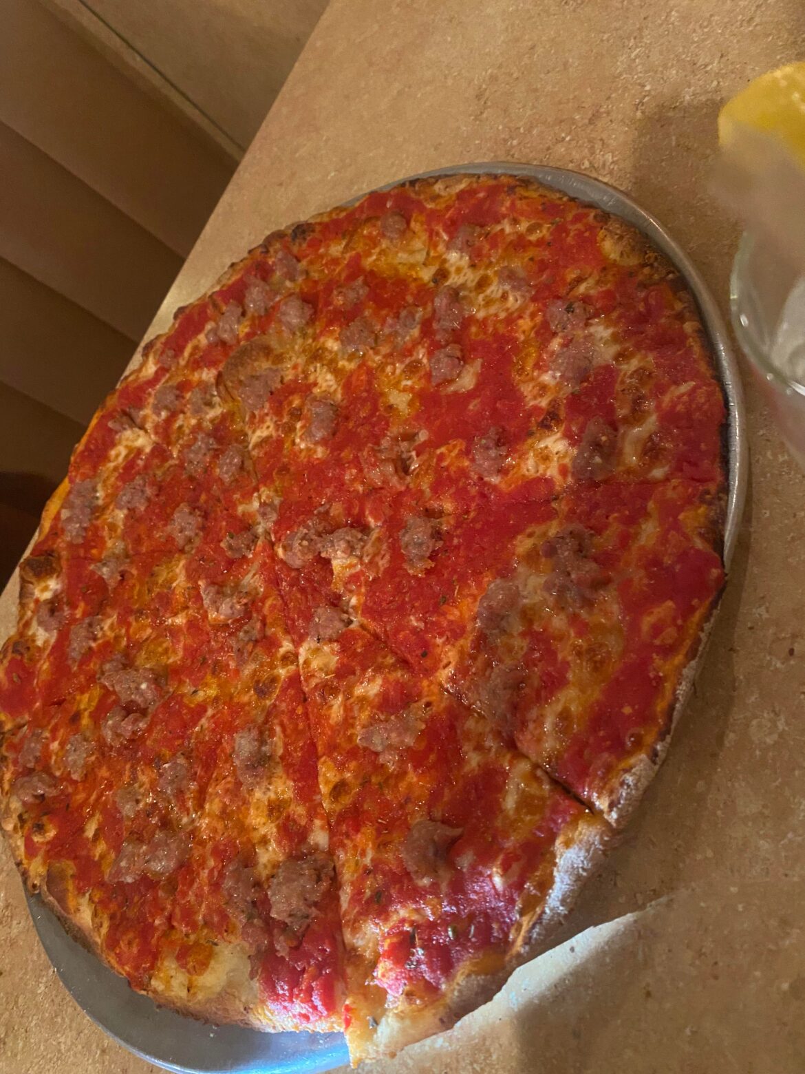 Original Tomato Pie with Sausage from Cesares Restorante in Bristol ,PA always cooked well done (Wish I could take better picture)