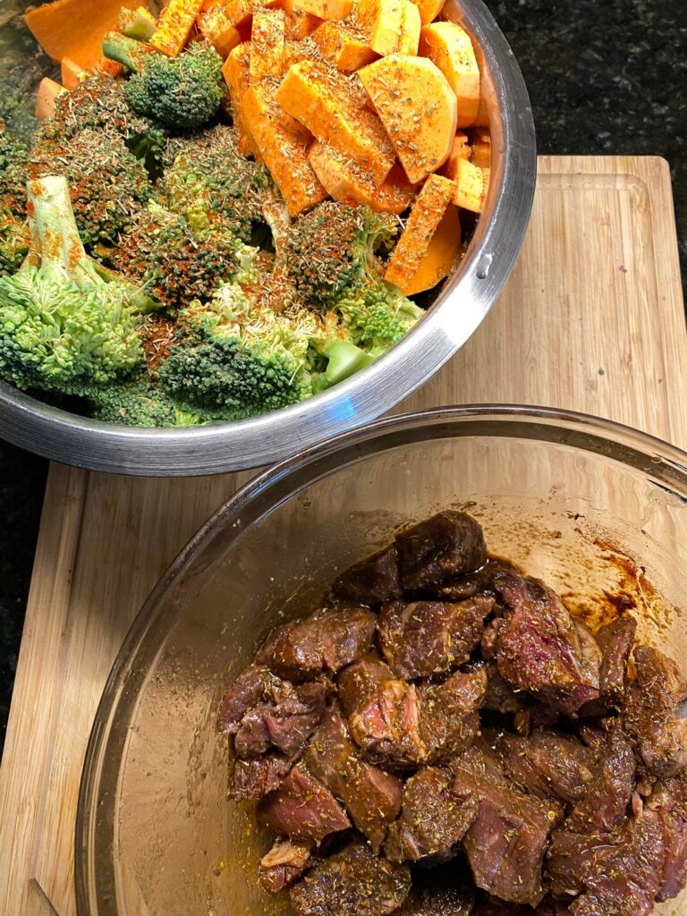 Marinated beef wjth balsamic vinegar/olive oil, carrots, broccoli, sweet potato oven roasted recipe - 425 degrees F for 20-30 minutes or until meat is cooked and vegetables are tender.
