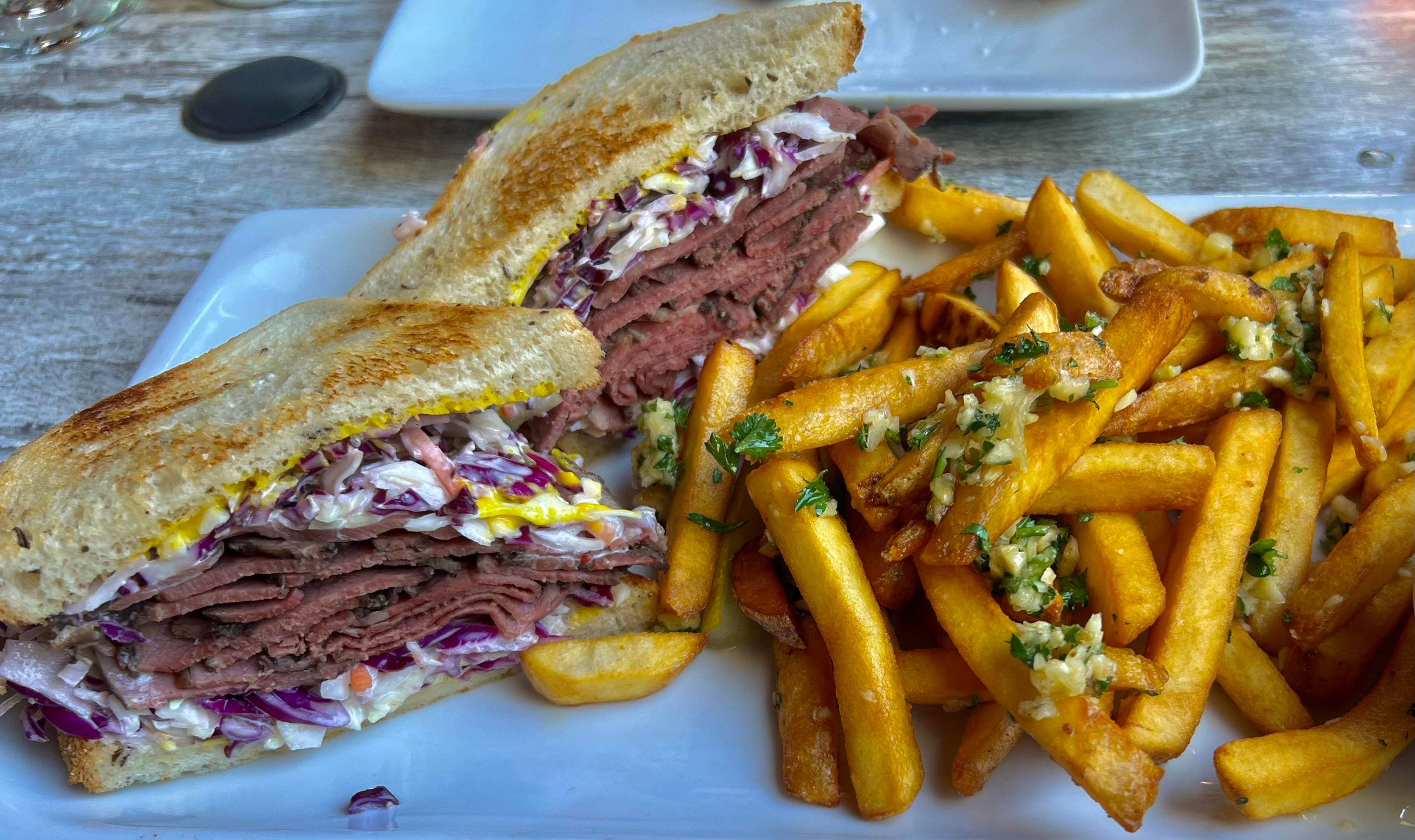 Pastrami, wasabi coleslaw on Rye. With Garlic fries. Dining and Cooking