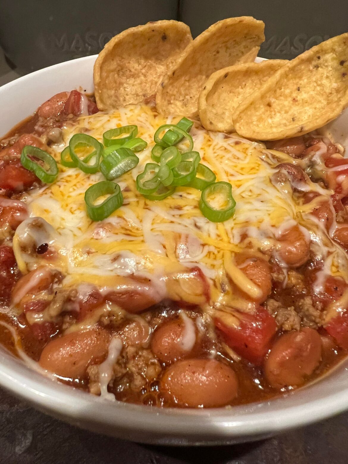 Homeade chili with Fritos scoops for dipping.