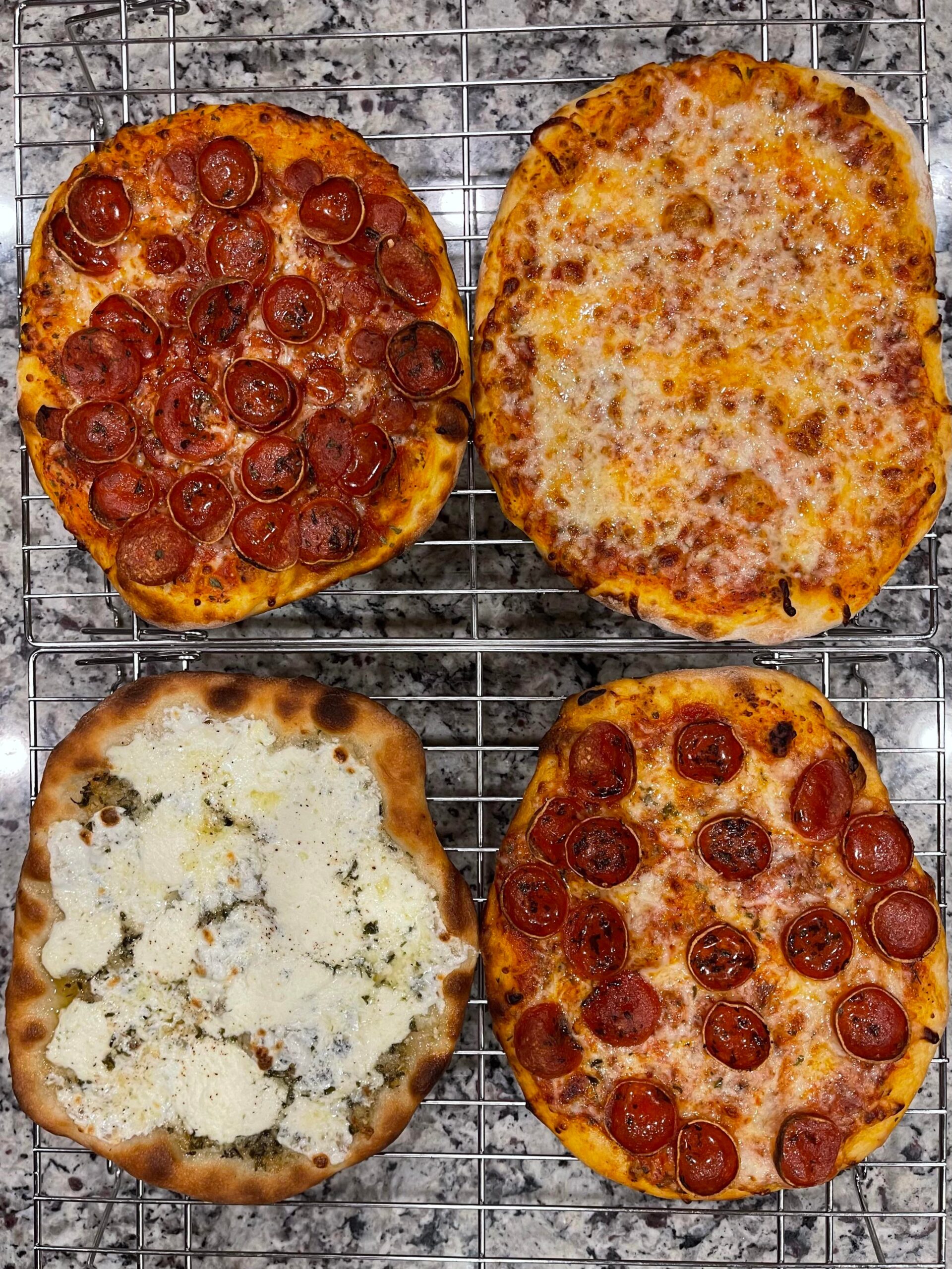 Four thin crusts. One cheese, one white garlic ricotta, one pepperoni