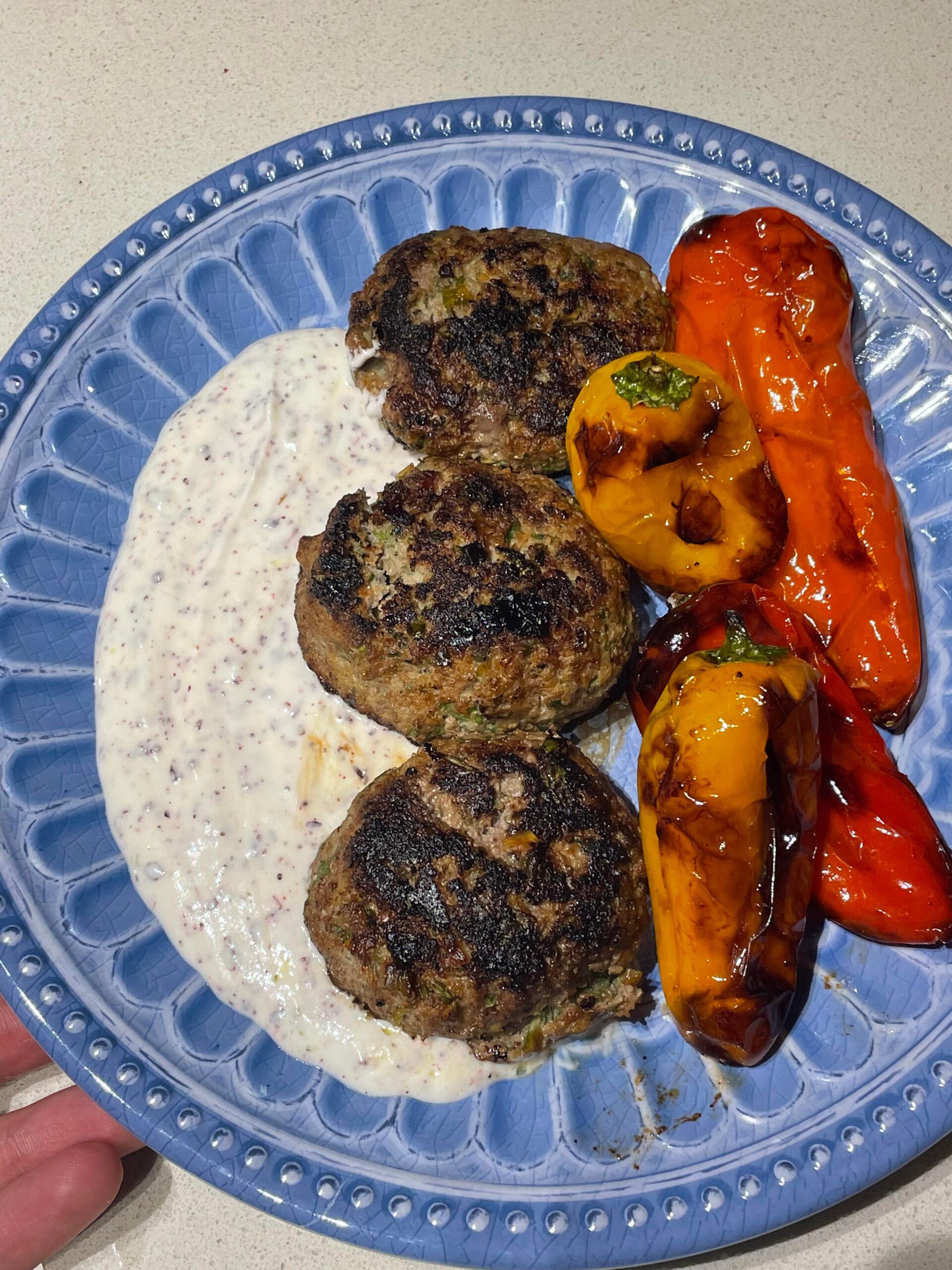 Lamb & pistachio patties, sumac yogurt sauce, and roasted sweet peppers